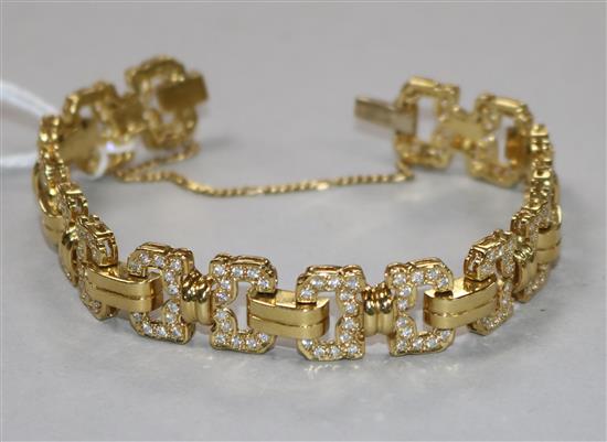 A yellow metal and diamond set fancy link bracelet, gross weight 41.4 grams.